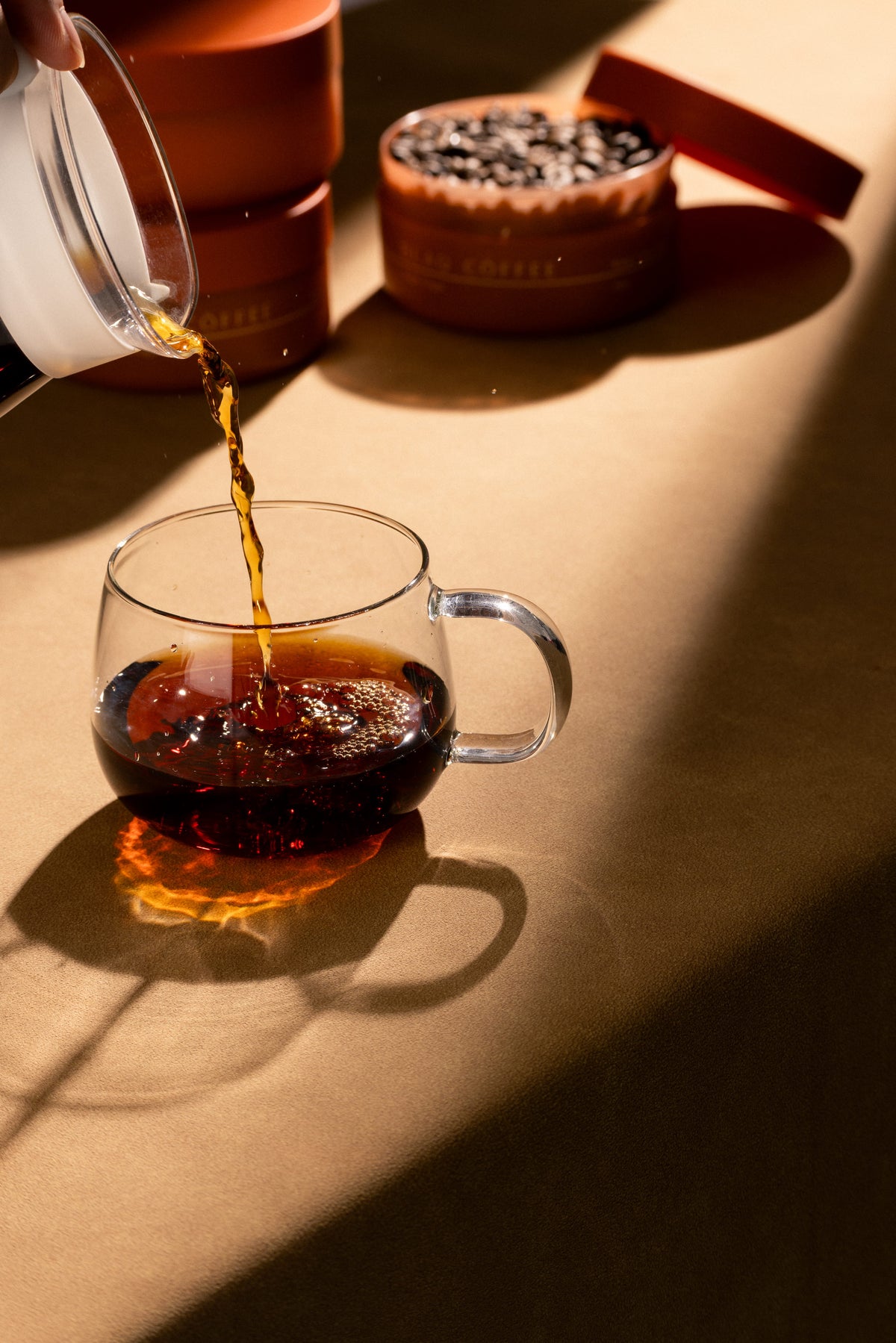 Filter coffee poured slowly into a glass mug. The ratio, not the bean, decides the cup.